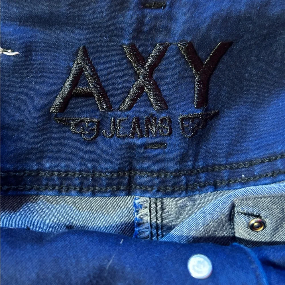 AXY vintage denim skinny jeans with embellished rhinestone bottoms